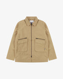 Front view of Uskees khaki ripstop field jacket showing the chest zip pockets and gusseted pockets with flaps.