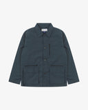 Front view of Uskees blueberry ripstop utility jacket showing the chest zip pocket and two gusseted hip pockets with flaps.