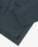 Close up view of Uskees blueberry ripstop utility jacket with focus on a hip pockets, zip pocket and reinforced elbows.