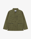 Front view of Uskees ivy green green ripstop utility jacket showing the chest zip pocket and two gusseted hip pockets with flaps.
