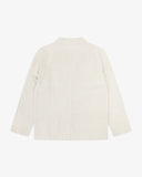 Back view flat shot of an Uskees cream linen blazer for men showing theback vent.