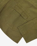 Close up view  of an Uskees linen blazer for men in woodland green showing the front pocket and cuff detail.