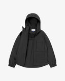 Front view of Uskees charcoal-grey Evo shell coat. Unzipped showing the inner lining, pocket and brand label.