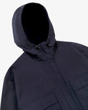Front view of Uskees midnight blue Evo shell coat with focus on hood and toggles.

