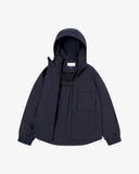 Front view of Uskees midnight blue Evo shell coat. Unzipped showing the inner lining, pocket and brand label.