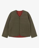 Front view of Uskees army green Evo liner jacket showing the two welt pockets and two-way YKK double-ended zip