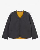Front view of Uskees charcoal-grey Evo reversible liner jacket showing the two welt pockets and two-way YKK double-ended zip.