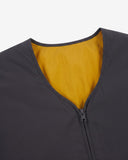 Close up view of Uskees charcoal-grey Evo liner jacket with focus on the neckline, bright yellow lining and zip.