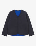 Front view of Uskees midnight blue Evo liner jacket showing the two welt pockets and two-way YKK double-ended zip