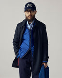 Front view of model wearing Uskees midnight blue Evo liner jacket. Reversed to show the bright blue lining as the outer shell.
