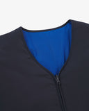 Close up view of Uskees midnight blue Evo liner jacket with focus on the neckline, bright blue lining and zip.