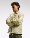 Top-half front view modelling Uskees 3052 pastel yellow check coach jacket.
