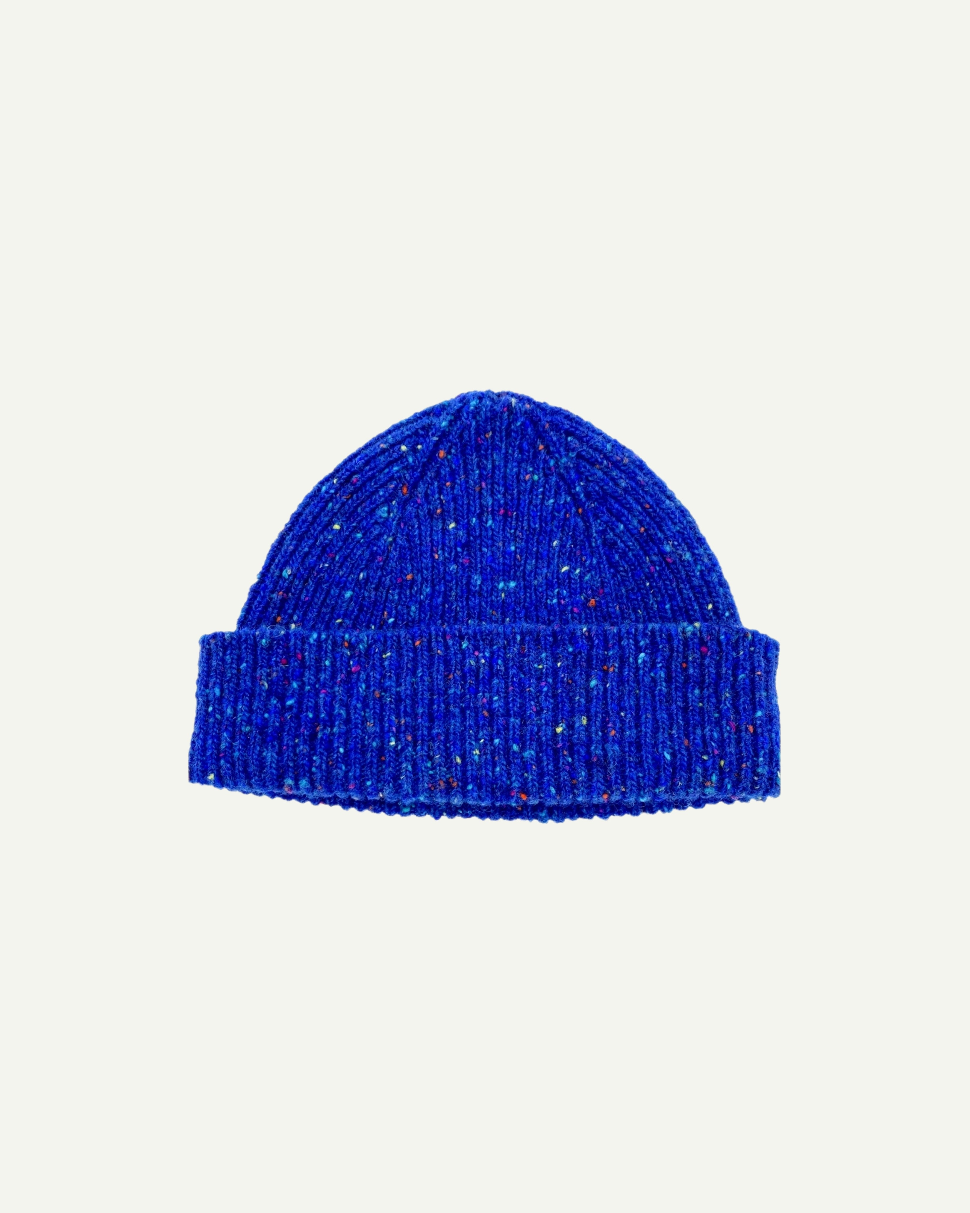  Flat view of Uskees 4003 donegal wool hat in 'ultra blue' . The image clearly shows the adjustable cuff of this bright blue hat.