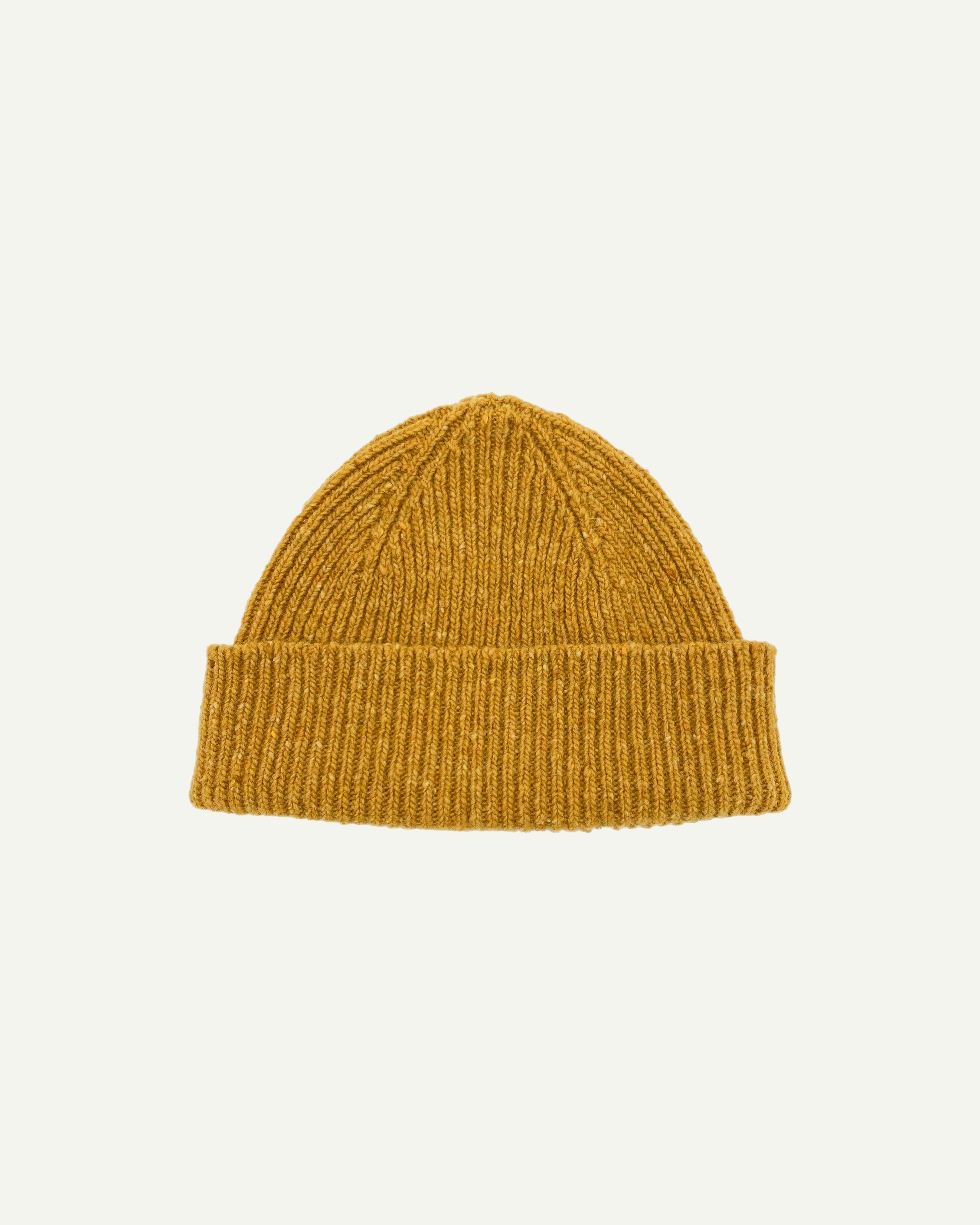  Flat view of Uskees 4003 donegal wool hat in yellow, with a clear view of the adjustable cuff.