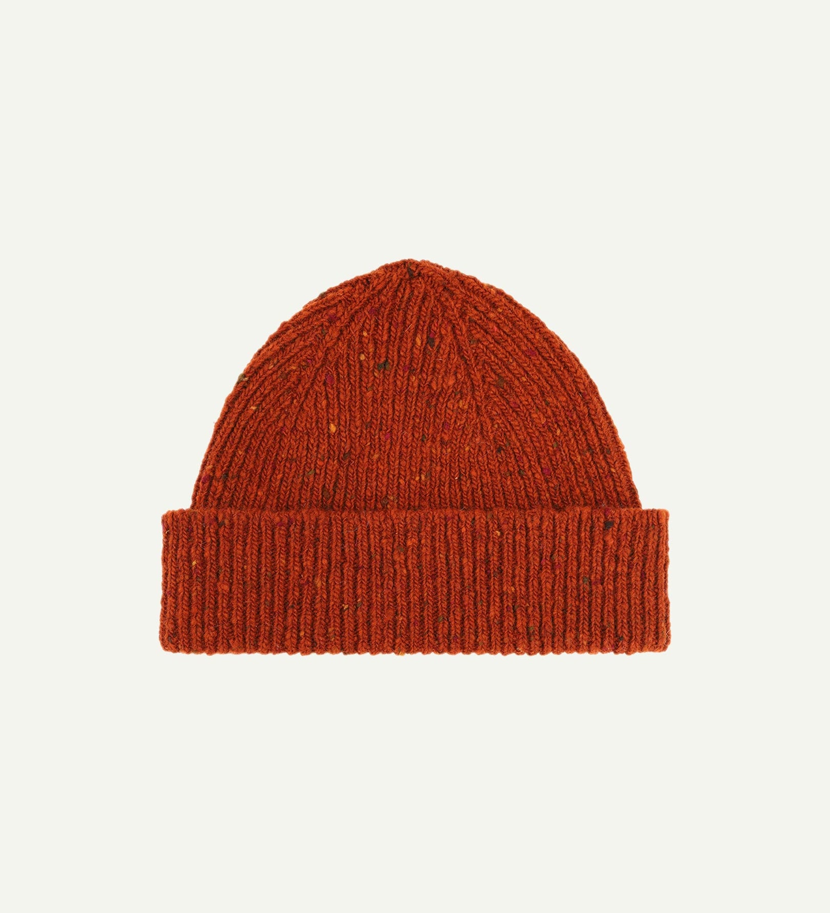 Flat view of Uskees 4003 'burnt orange' donegal wool hat, with a clear view of the adjustable cuff. Clearly showing the 'speckled' detail of the wool hat.