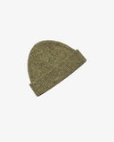 Angled view of Uskees 4003 herb green speckled Donegal wool knit beanie.
