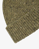 Close-up of the herb green Donegal wool hat from Uskees, showing the ribbing, speckled detail and texture of the natural Irish Merino wool.