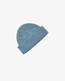 Angled view of Uskees 4003 powder blue speckled Donegal wool knit beanie.