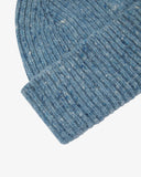 Close-up of the powder blue Donegal wool hat from Uskees, showing the ribbing, speckled detail and texture of the natural Irish Merino wool.