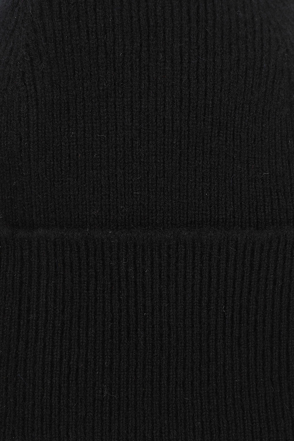 Close-up view of Uskees 4004 black wool hat, showing the texture of the natural lambswool.