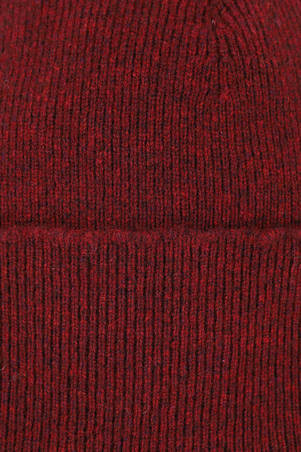 Close-up view of Uskees 4004 red wool hat, showing the texture of the natural lambswool.