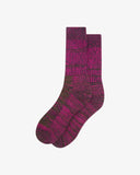 Flat view of Uskees 4006 magenta sunset organic cotton sock, showing bands of magenta, brown and black.