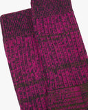 Closer look at the upper portion of the Uskees 4006 magenta sunset organic cotton sock, showing the ribbing and the random parallel knitting pattern.
