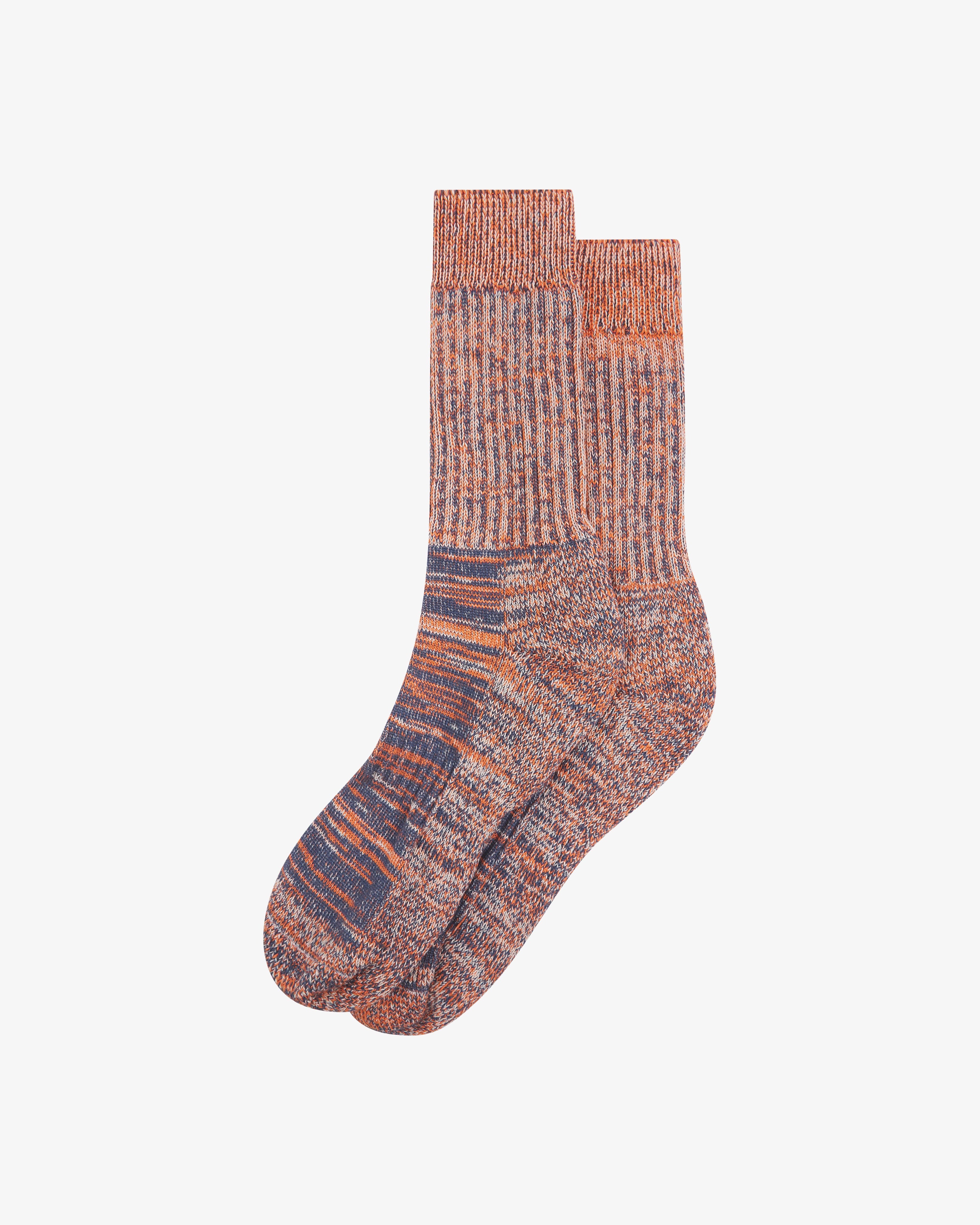 Pair of Uskees Men's socks in orange stripe pattern on a white background