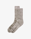 Pair of Uskees men's colour fuzz socks in a green/grey colour on a white background.