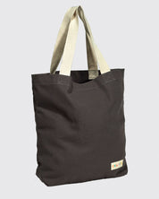 Slightly angled front view of Uskees #4009 'charcoal' coloured canvas tote bag, showing double webbing straps and Uskees woven logo.