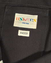 Close-up inside view of Uskees #4009 canvas tote bag in charcoal-grey with focus on the internal patch pocket and branding logo.