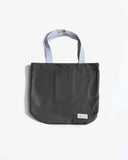 Uskees charcoal grey canvas tote bag  on a white background showing the brand label.