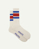 Flat view of a pair of Uskees 4011 berry red, organic cotton, college stripe socks, showing coloured bands of red and blue and the Uskees branding at the base of each sock.