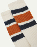 Closer view of the upper leg of a pair of Uskees 4011 socks, showing the 'college stripes' comprising of two midnight blue and one thicker gold-orange band.