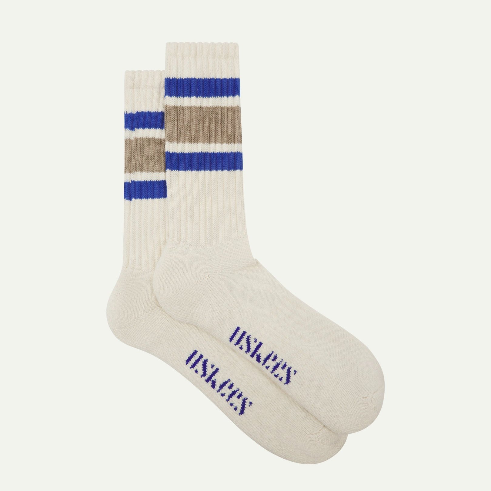 Flat view of a pair of Uskees 4011 khaki, organic cotton, college stripe socks, showing coloured bands and the Uskees branding at the base of each sock.