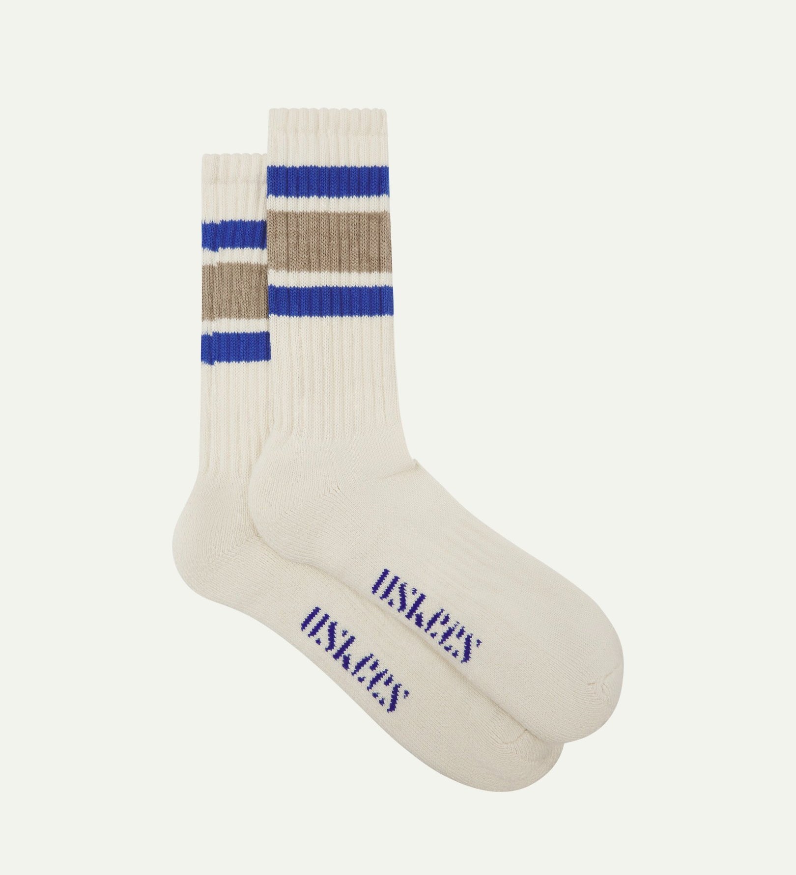 Flat view of a pair of Uskees 4011 khaki, organic cotton, college stripe socks, showing coloured bands and the Uskees branding at the base of each sock.