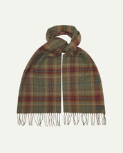 Uskees scarf presented on a flat white surface - tied and showing the green and red check pattern and tassels.