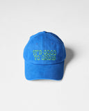 Bright blue Uskees 6-panel cap with 'It's Good to Grow' embroidered motif in green.