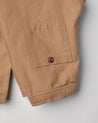 Close-up view of #5001 Uskees drawstring pants in khaki showing triple stitching and back pocket.