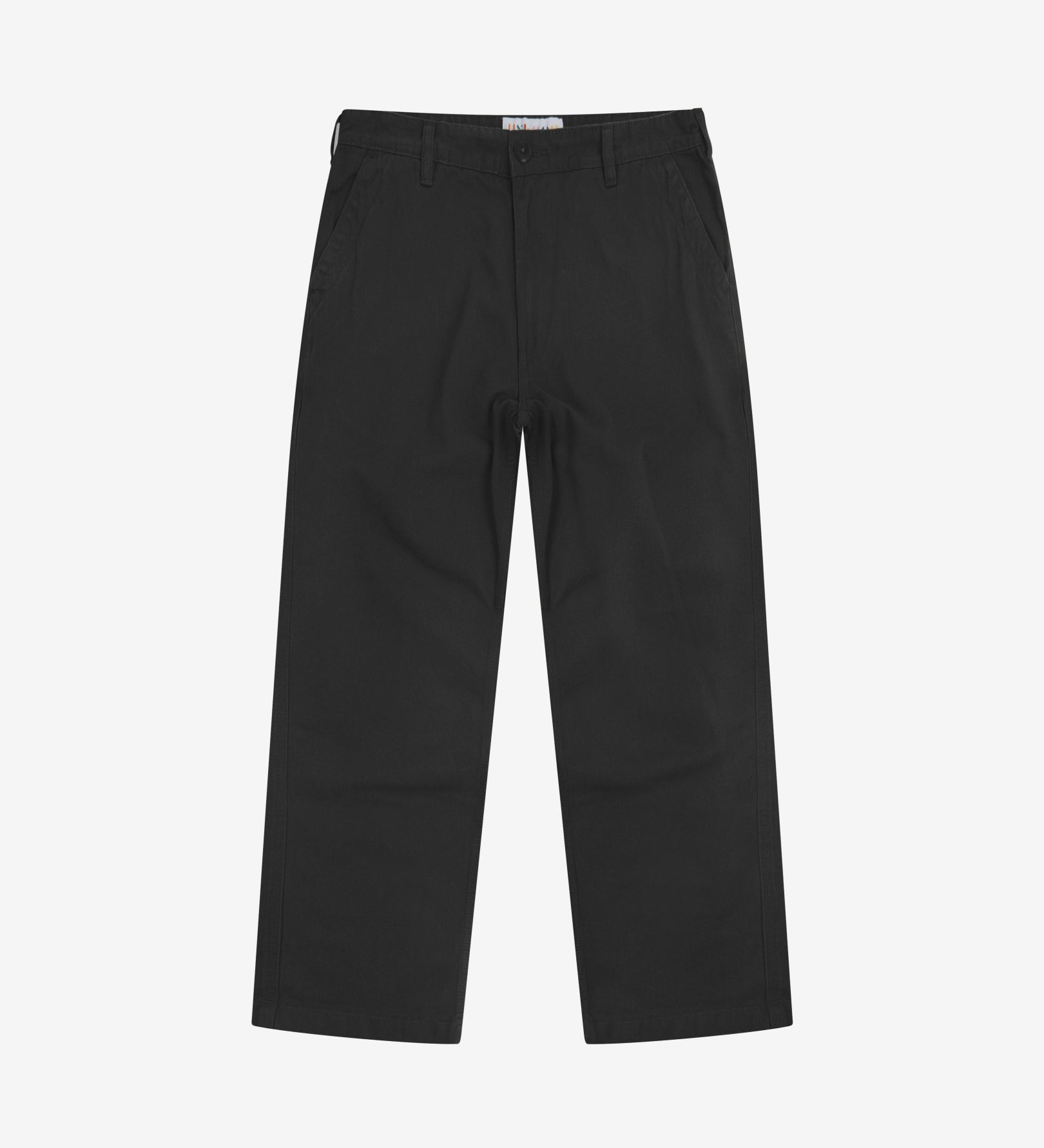 Full-length front view of Uskees twill workwear pants in black. Showing Corozo button fastening and tapered leg fit.