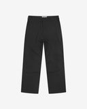 Full-length front view of Uskees twill workwear pants in black. Showing Corozo button fastening and tapered leg fit.