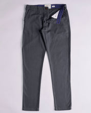 Front flat view of 5005 Uskees men's organic cotton charcoal-grey casual trousers. Zip down to reveal corozo button, contrasting lining and Uskees branding label. Discontinued colour.