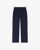 Full length back-view of deep indigo corduroy 5005 trousers with view of rear pockets, belt loops and flattering straight leg fit.