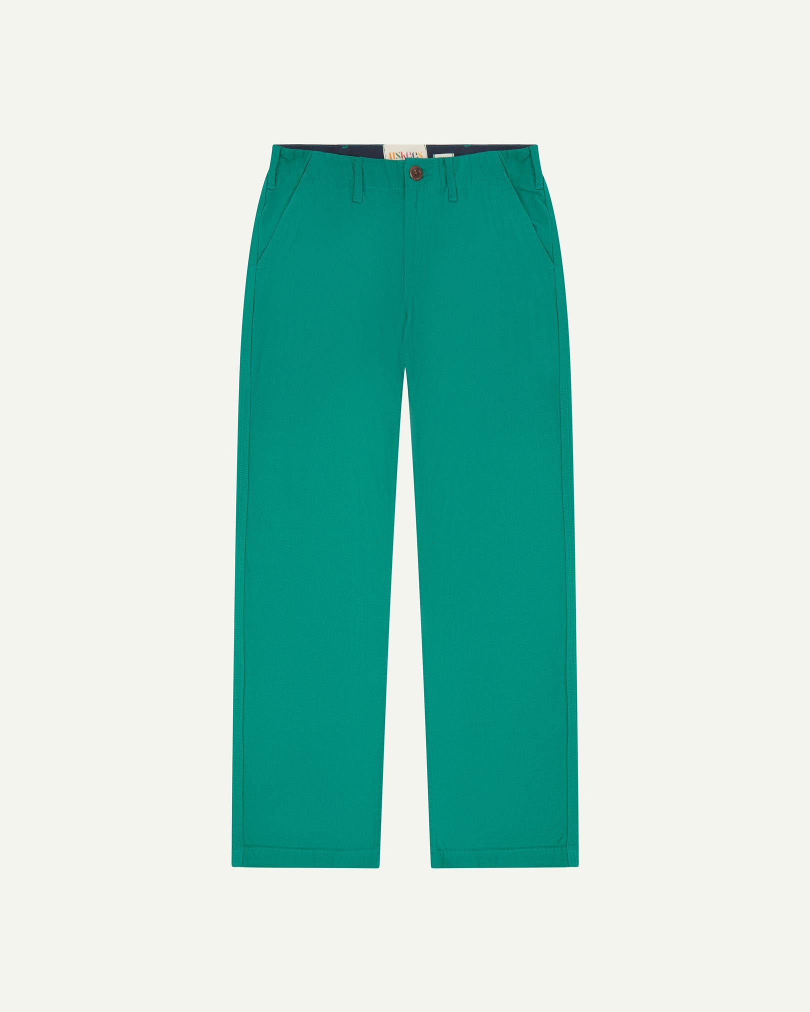 Front flat view of 5005 Uskees men's organic cotton foam green casual trousers with view of YKK zip fly and Corozo buttons.