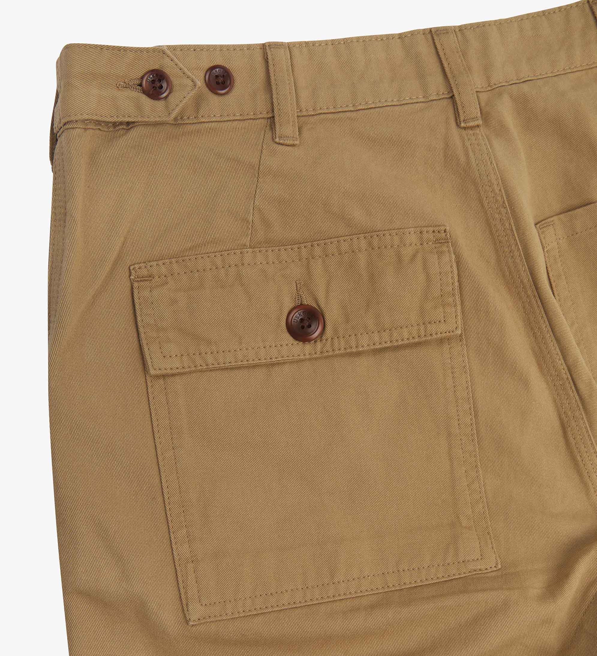 Close up back shot of Uskees 5005 twill workwear pants in khaki with focus on back pocket, adjustable waistband secured with Corozo button and belt loops.