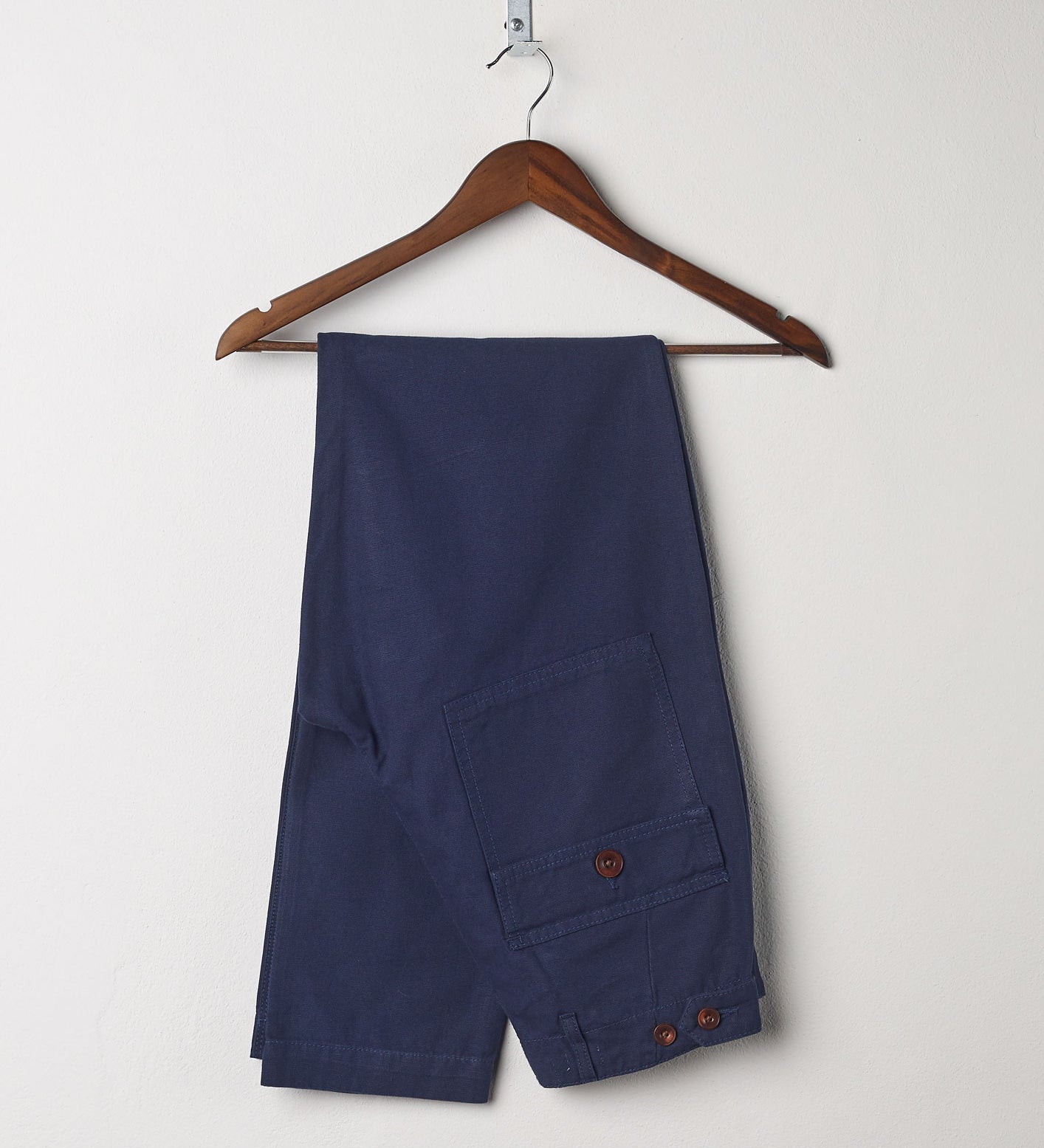 Folded front hanging shot of #5005 Uskees men's organic cotton navy casual work trousers.
