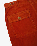 Close-up reverse view of Uskees rust-red corduroy work pants with focus on left rear flap pocket, belt loops and adjustable button waist.