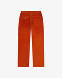Full length back-view of rust-red corduroy 5005 trousers with view of rear pockets, belt loops and flattering straight leg fit.