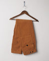 Folded hanging shot of #5005 Uskees men's organic cord 'tan' casual trousers.