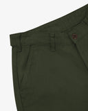 Close up of waist area of drill workwear pants in vine green. Clear view of front pocket, Corozo button fastening, and organic cotton drill weave.